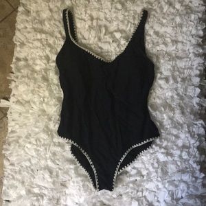 Black one piece swimsuit with white lining